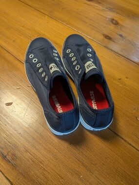 Converse Slip-On Canvas Sneakers in Navy with Red Insole